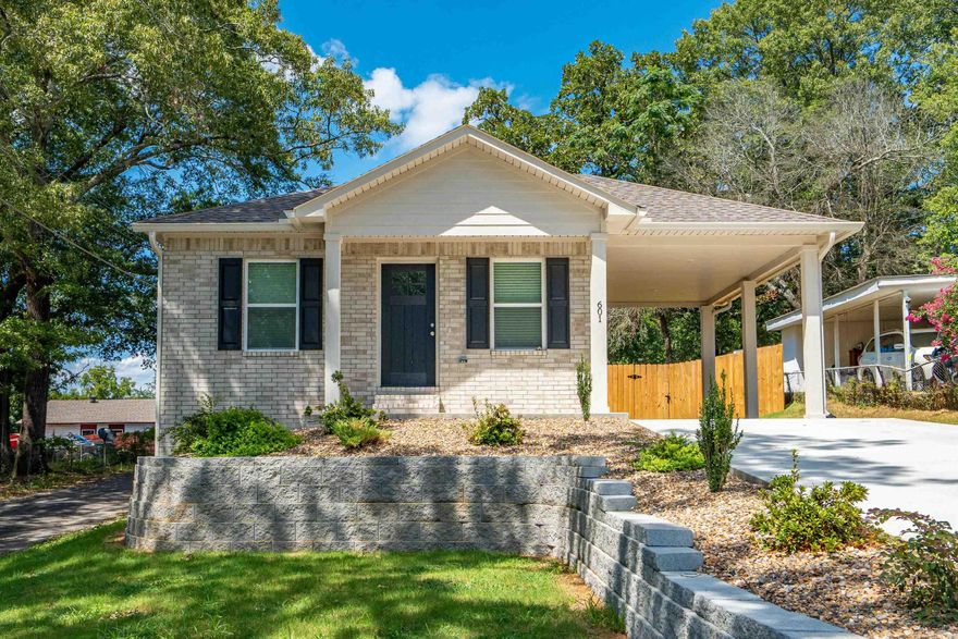 Welcome to your dream home! This beautiful home features an all-brick exterior and a one-car carport, complemented by upgraded fiberglass exterior doors. Inside, you'll find a spacious living area with neutral beige paint and luxury vinyl plank flooring, creating a warm and inviting atmosphere. Enjoy ceiling fans in the living room and two bedrooms for year-round comfort. The kitchen is a chef’s delight, showcasing black leathered granite countertops, sandstone stain cabinets, with black hardware. A freestanding stainless steel stove, dishwasher, and microwave add convenience. The adjacent laundry room enhances practicality. Retreat to the master suite, featuring a generous walk-in closet with energy-efficient windows that let in natural light. The home is wired for fiber Cat 6, perfect for all your tech needs. Additional highlights include architectural shingles, gutters with leaf guards, and outside storage, all in a crawl space for easy access. Disc LED lighting is energy efficient. This home is designed for efficiency and style, making it the perfect choice for modern living. Yard will be sodded. It is located in the Trivista neighborhood close to shopping, hospitals, Oaklawn,