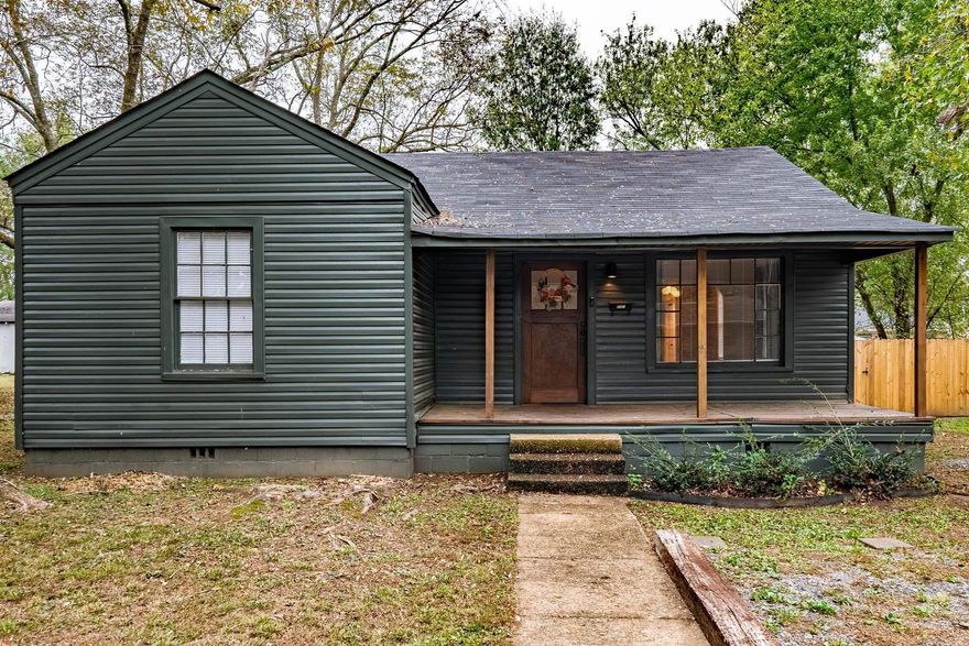 Charming updated downtown Conway home with 3 beds/2 baths and formal dining room on an almost half acre with a fully fenced backyard! The welcoming front porch leads into the home with a large living area with refinished hardwood floors. The precious galley kitchen features a gas stove, tiled backsplash, pot wrack/hangers and floating upper shelves. The formal dining room has custom wallpaper, arch, doorways, and brushed gold chandelier. The split floor plan features nice sized bedrooms with hardwood floors and great natural light. The two guest bedrooms share a full hall bath while the primary bedroom overlooks the backyard and has an en suite bath with walk-in tiled shower. The backyard is spacious with a new wood privacy fence with front and back gates and a storage building.