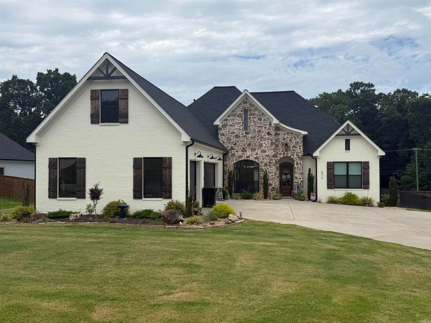 Come see this custom-built 4 bed, 3 bath (plus upstairs bonus) home in Benton School District with approx. 3000 SF. Open floor plan with large living room and gas log fireplace. Kitchen features island, gas cooktop, wall oven, pantry, and abundant cabinetry. Split bedroom layout. Spacious primary suite with double closets, oversized custom closet, and tile shower. Bonus room with mini-split. Hardwood floors, tankless water heater, floored attic storage. Level, fully sodded yard with sprinkler system and established landscaping. Covered patio with gas fire pit, 6-person hot tub, TV, and included L-shaped couch from shed will convey. Turf area with backstop for tee work, pitching, or soccer. In-ground basketball goal. Yard is beautifully landscaped. 3-car garage, 2-car bay has mini-split. Patio privacy blinds (ready to install), curtains, blinds, mirrors, and shelving all stay. Great layout, LOADED with extras, ideal for entertaining! AGENTS SEE REMARKS!