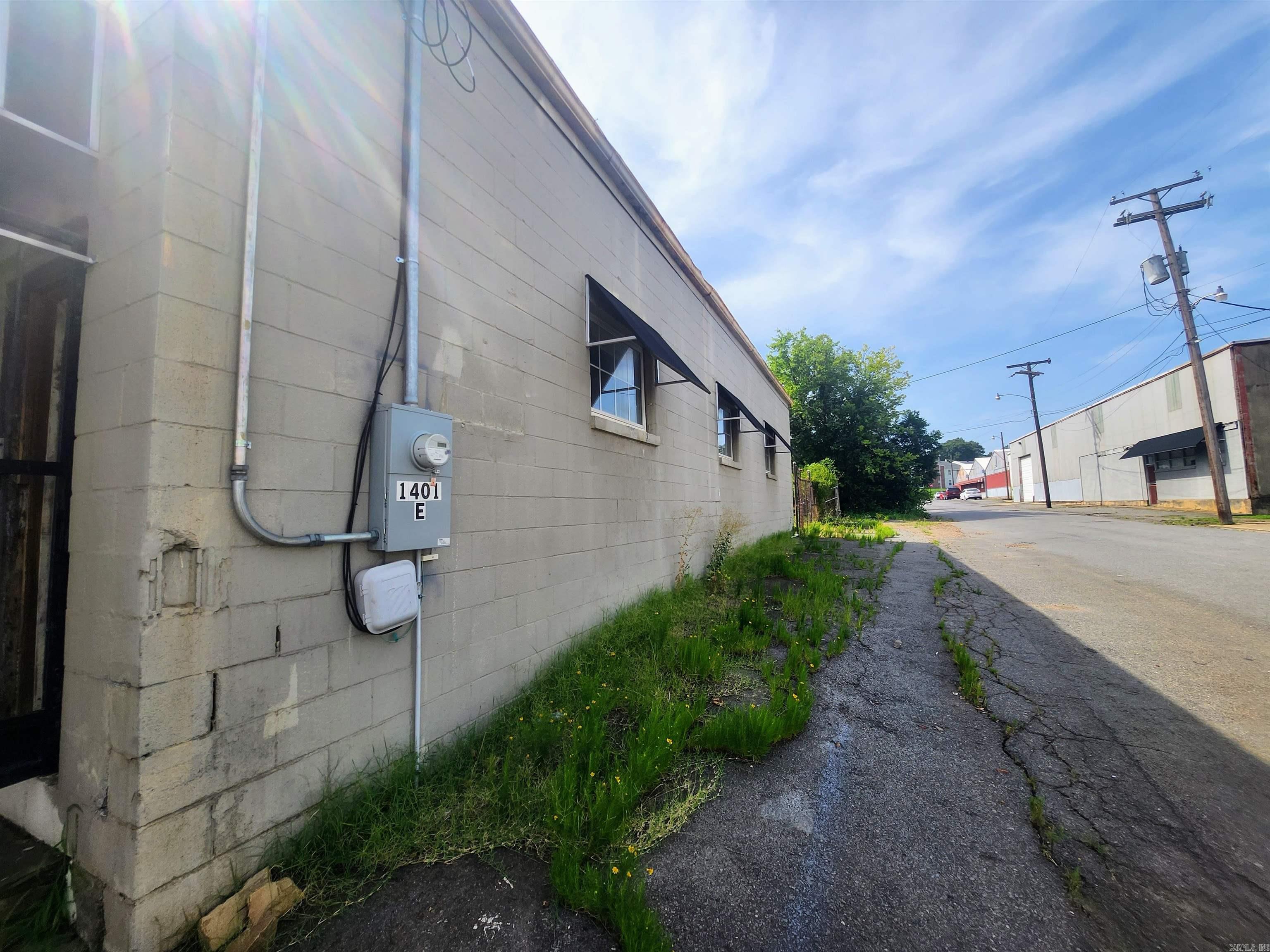 Currently in 5 units. 432 sq ft office being used as a church, 2 other offices - these have new paint and flooring. Upstairs there is a living quarters with 2 bedroom and 864 sq ft, Plus a 1800 sq ft Warehouse style room. New roof in 2020. 2 new mini split ac/heat units in 2020 also. Corner lot.