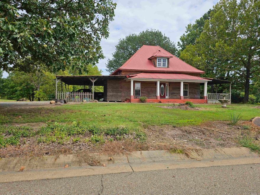 What a gem!! Located inside Cove, AR, on almost 4 acres with a stocked pond consisting of a variety of fish (bass, blue gill, catfish, crappie).  Center of the pond is 22 ft deep. Several ornamental and fruit trees, carport, city utilities, large 3 car carport and a chain-link fence in the backyard to keep the fur babies safe. Being built in 1950, this home has some amazing features: hardwood floors, solid wood doors, primary has a nice sized walk-in closet, the dining and bedrooms are roomy as well, storage galore. In case of a storm, just walk downstairs to the cellar; no need to go outside. This home is 1992 sq ft but when walking inside, it feels so much larger.  Such a quiet neighborhood, just picture sitting on the porch, sipping iced tea or coffee while the kids and grandkids are having a wonderful time on the huge wrap around porch.