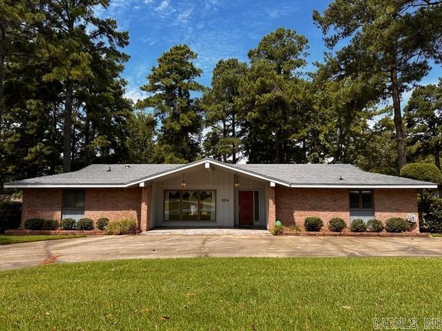 MAJOR PRICE IMPROVEMENT! Many custom features in this beautiful home. Located in Vivian Manor with convenient access to main highways, schools, hospital, and doctors' offices. 4 bedrooms, 1 bonus room, home office, 3 baths, 4152sf, sitting on .41 acre corner lot. Remodeled & updated kitchen, breakfast nook & bathrooms. 50 year steel shingle roof placed in 2000.The house is centered around a beautiful, private courtyard. This home is perfect for entertaining and a growing family. A separate room with access to the courtyard, back porch and garage would be a great hobby room, playroom, an office with exterior access or it could be a 5th bedroom if needed. A sunken living room looks into the courtyard with light and bright windows and a separate den with gas fireplace & family size hearth for family gatherings. A Generac whole home generator and Rainbird sprinkler, 3 electric water heaters are also included. Call today to make an appointment to see this beautiful home. Please see agent remarks.