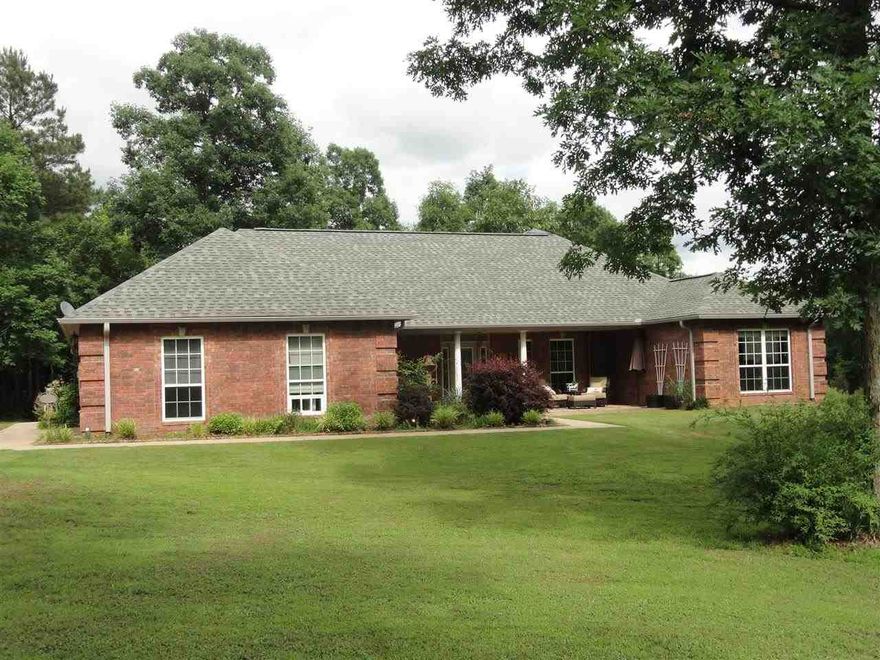 Absolutely gorgeous! Tranquil lake setting. Beautiful custom built home on 10 acres. Lake is 3 acres with all types of fish even Tilapia. Huge KOI!! Fountain is awesome with light show. Aeration filter system to keep water fresh! Lots of geese & deer. Nature lovers this is it! Home has open floor plan with great room that features a wood burning fireplace. Kitchen has new movable island. Dining area overlooks patio.  Master bedroom has stunning view of lake. Split bedroom plan. Even garage is neat! MUST SEE