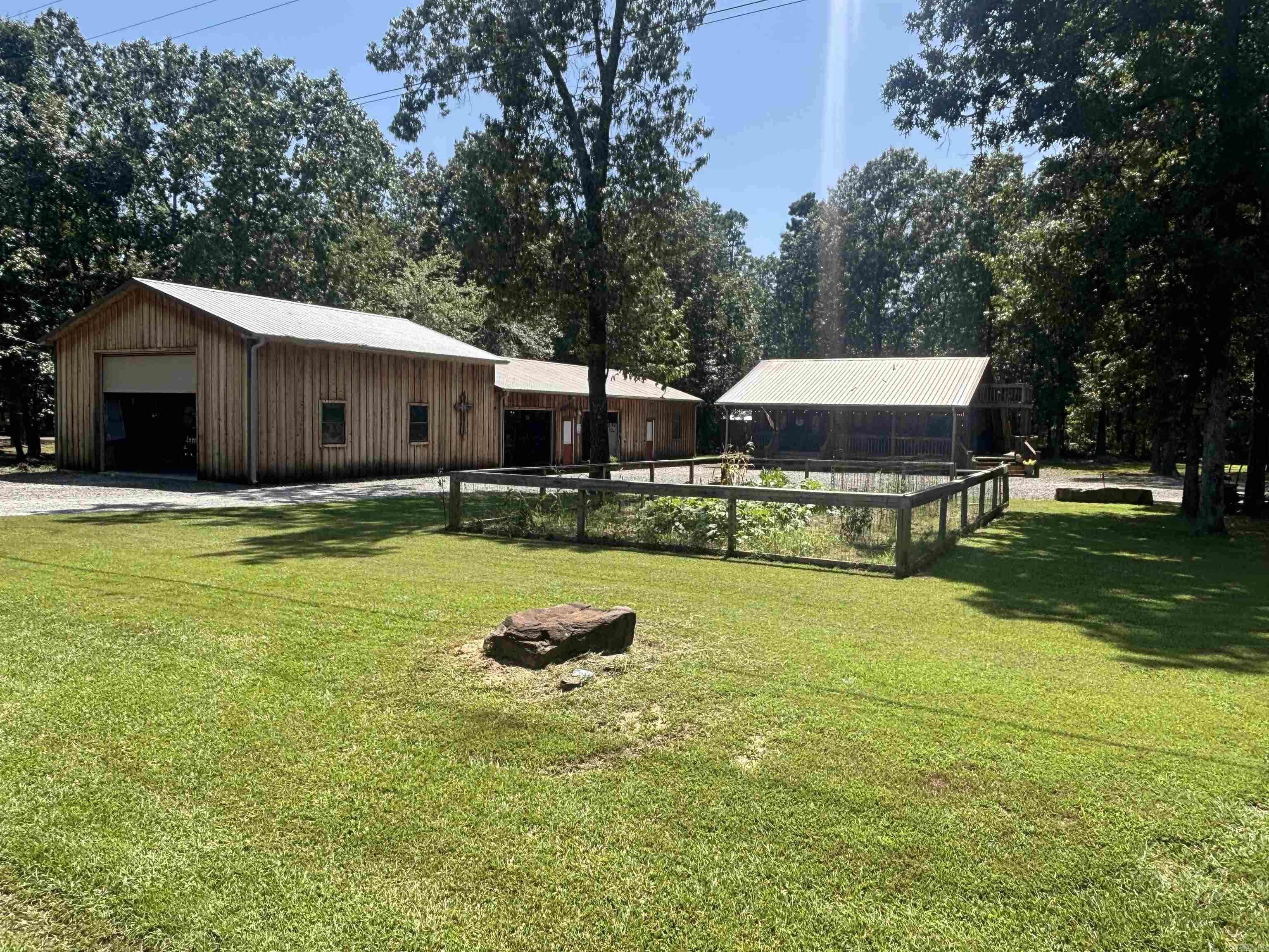 Are you looking for a Lake Property with it all? Well you just found it! Enjoy your beautiful cabin home with 2bdrm down & a loft w/3rd bdrm 2 full baths on main floor! Wonderful master suite w/ large masterbath huge shower 2 shower heads! Exit your mastersuite out to back patio and relax in you private hot tub! Visit family & friends on your big front porch! But there's more! Just a few steps away awaits your 30x90 shop offering 30x40 13&1/2 ft tall w/ garage door for parking RV, party barge, vehicle of your choice! Also offering a 30x35 10ft tall area w/2 garage doors! This area is currently used as party area/ game room with gas heat for winter time! Could also be used for extra parking garage! Within this building you'll also love the 30x25 10ft tall guest h/c apartment w/full klitchen & full bath! Let your guest stay over or use as mother in law suite or arbnb. Unit has it's own septic tank! Very nice storage building out back stays as well! There are so many options with this property! Lots of fun & enjoyment awaits! Seasonal Lake View! Come check it out!