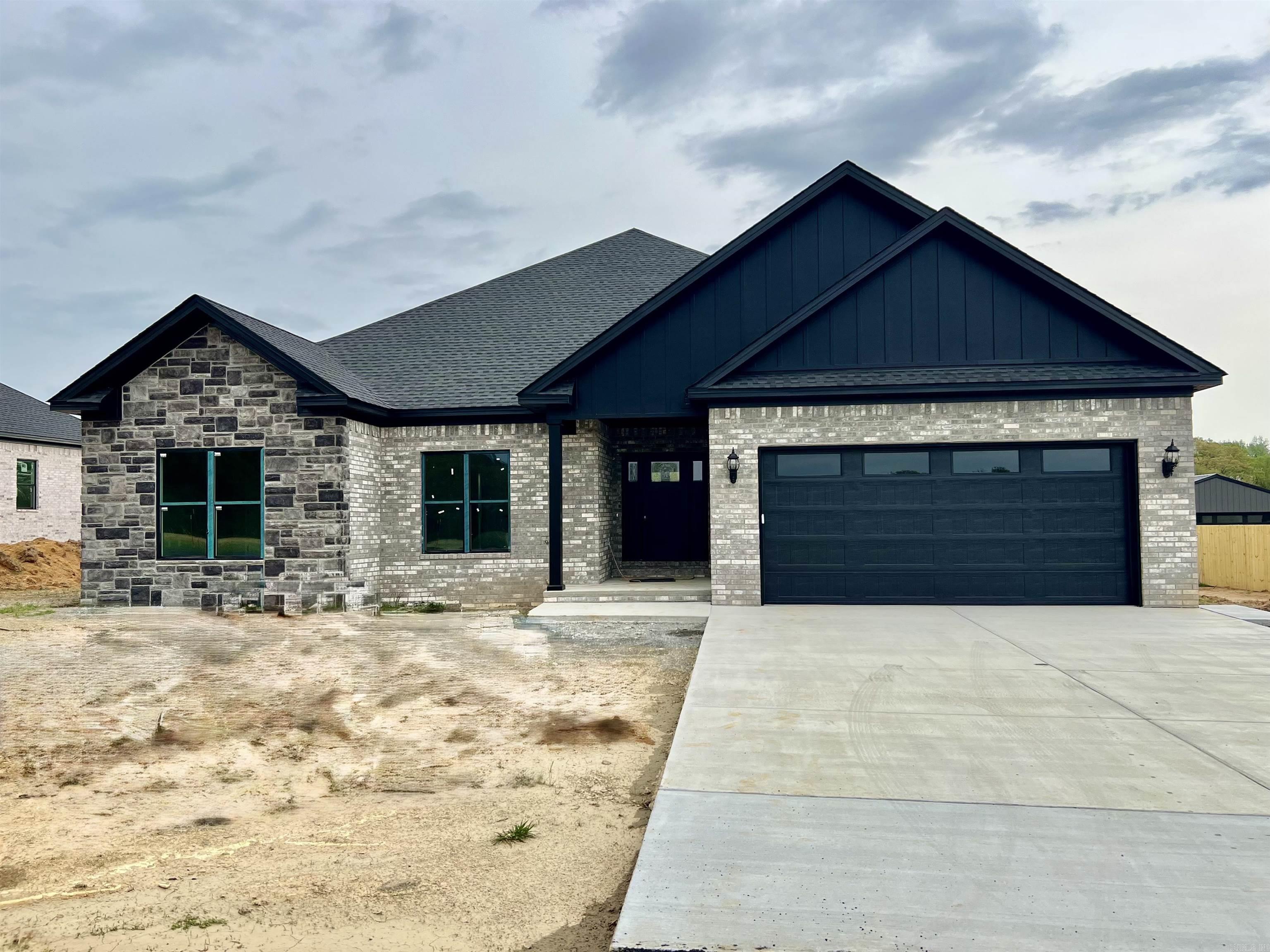 COMPLETED NEW CONSTRUCTION READY FOR NEW OWNER! This home is just on the outskirts of Conway city limits which makes for an easy commute. 4BD 21/2BA open floor plan on 0.80 acres. Split floor plan with Luxury vinyl throughout except tile in the wet areas, Kitchen has quartz countertops with tiled backsplash, 8ft Island bar, custom cabinets with underneath lighting, stainless steel appliances, pantry. Tankless water heater, Master walk in closet, tile shower & Soaker tub, quartz countertops, Oversized Garage for those with big vehicles or a boat. Covered back porch with patio.This homes also comes with REFRIGERATOR, WASHER, and DRYER.Home qualifies for Rural Development( 100% financing). The road has been paved. This home is a must see!
