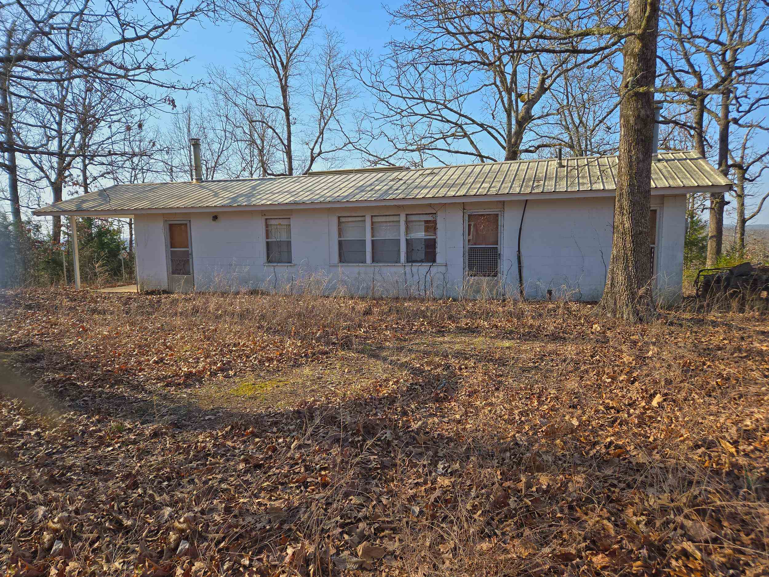 40 ACRES HUNTING LAND WITH CABIN located off Nine-Mile Ridge in Fulton County. Native woods with recorded easement to the property. 736 sq ft concrete block cabin with slab floor, living room, bedroom, kitchen, and 3/4 bath/utility room. Stove, refrigerator, washer/dryer, microwave, and some furniture included. 2 free-standing wood stoves, window air conditioner in storage. metal roof, 260 ft deep well (cabin interior plumbing is not guaranteed), NAEC electricity, 8x16 covered front porch, 6x10 storage building. Area around the cabin is cleared, with potential for vista view of miles of foothills if trees cut back again out from the porch. 40 acres with a cabin is a hard find nowadays... a hunter's delight, or wonderful for someone just wanting to be secluded and off the grid. A current survey has been ordered to remark the corners.