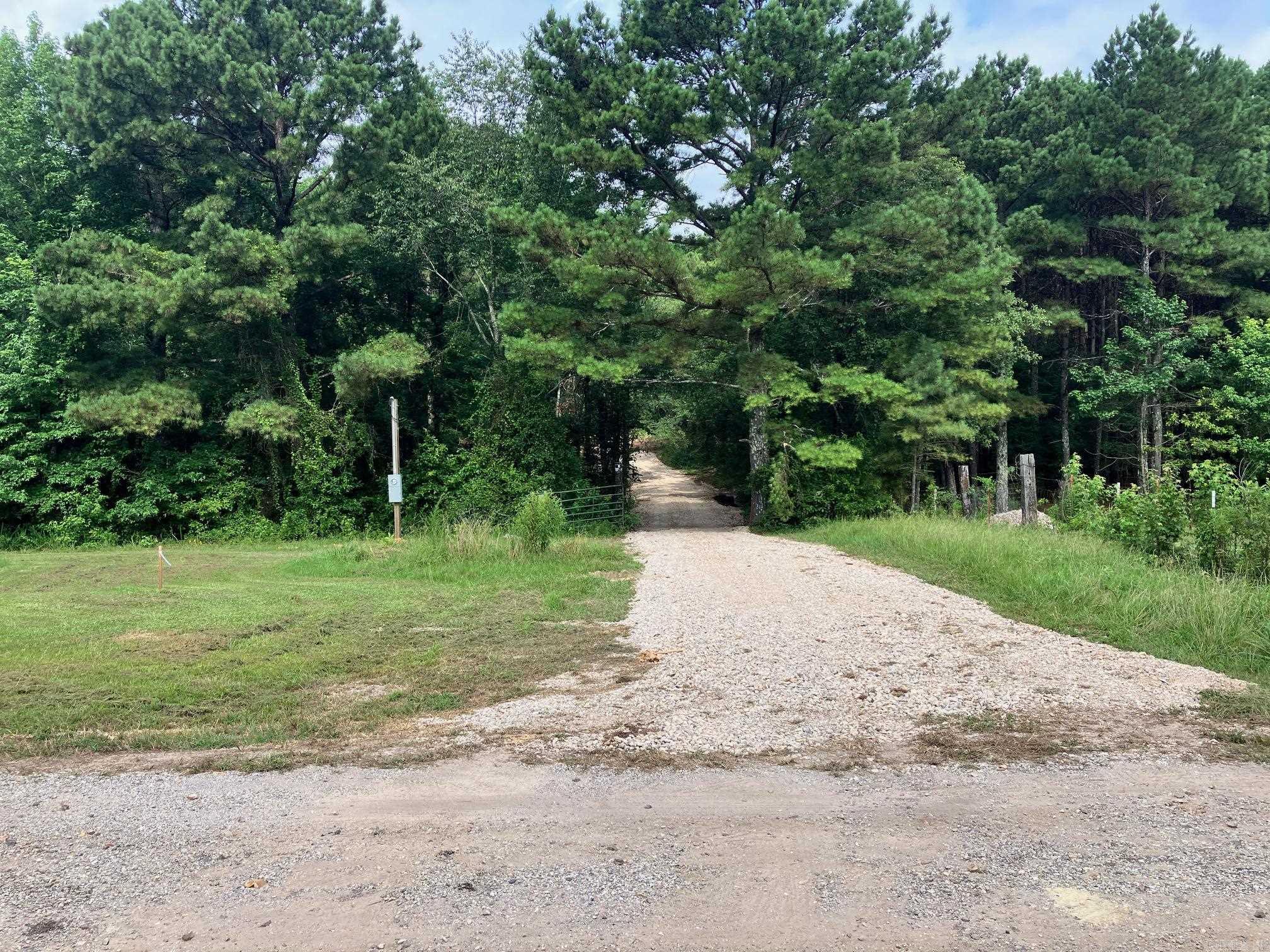 FOR SALE 4.76 . Discover this spacious 4.76 Acres parcel located in the charming community of Bismarck. Bordering the Ross Fountation, this property offers a perfect blend of cleared land and wooded areas, proving both privacy and natural beauty. This site is already prepared with a gravel driveway and electric pole in place, with utilities conviently located at the road just a short distance away. Weather you're looking to build you're dream home or have a private retreat, this land offers endless potiental. Dont miss out on this exceptional opportunity!