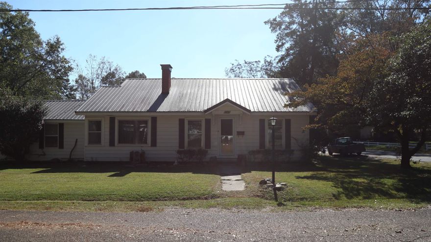 This nice, historic home in the heart of Camden, offers 3 bedrooms, 2 baths, with a walk in closet in the primary.  It has a living room, dining room, and den.  The backyard includes a wonderful back covered patio, as well as, a glorious gazebo.  In this fenced in backyard there is a storm shelter.  This house includes a well sized 2 vehicle carport.  It also includes a 900 sq foot shop.  This shop includes a bathroom and kitchen. It could be used as a rental property for the buyer.
