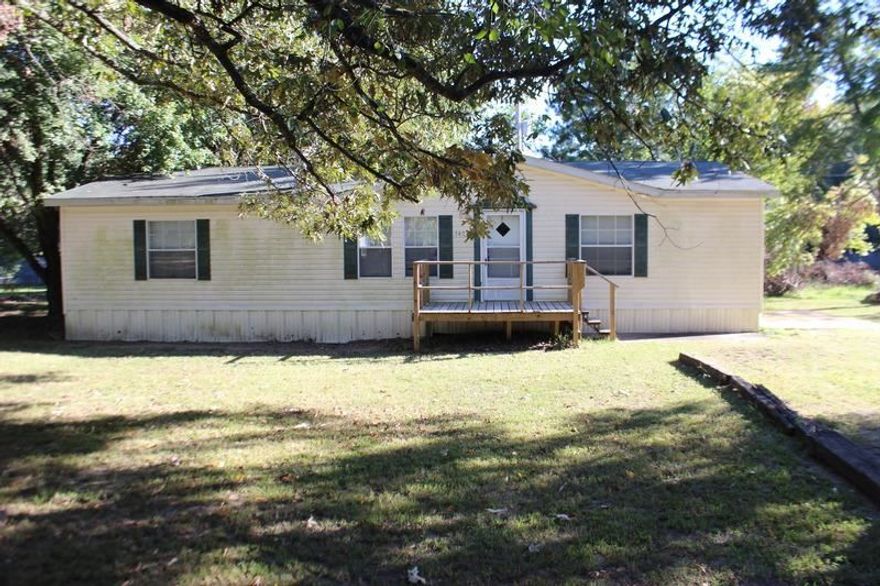 This property is a great manufactured home situated on 3.75 acres. The cozy family room has a fireplace and leads into the dining room that is open to the kitchen. The kitchen features a breakfast bar and abundant cabinetry. All of the bedrooms offer walk-in closets. The large master suite offers dual vanities, a corner garden tub and a separate shower. Other amenities of this home include an outdoor storage area and a deck.