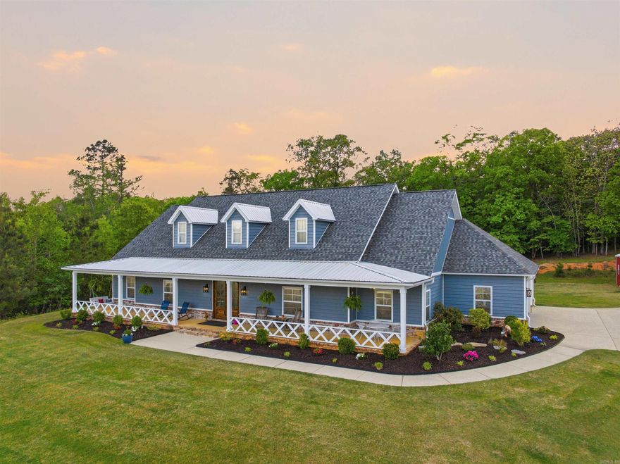 Hard-to-find acreage with a 30x30 shop just minutes from Benton. Located just off Highway 5, this beautiful 4 bedroom, 3.5 bathroom home sits on 3.54 acres and offers 3,022 square feet of living space with the privacy many buyers are looking for while still being close to town.  A long driveway leads to the home, creating a peaceful setting surrounded by trees and open space. Inside, the home features a spacious kitchen with custom cabinetry, stainless appliances, and a large island that opens into the living area with a brick fireplace, built-ins, and a wood ceiling accent. The primary suite offers a relaxing retreat with double vanities, a soaking tub, walk-in shower, and views of the surrounding property.  One of the standout features of the property is the large shop with water, electricity, and its own bathroom, making it ideal for projects, storage, equipment, or hobbies. Enjoy the covered front porch, open acreage, and quiet setting while still being just minutes from Benton.