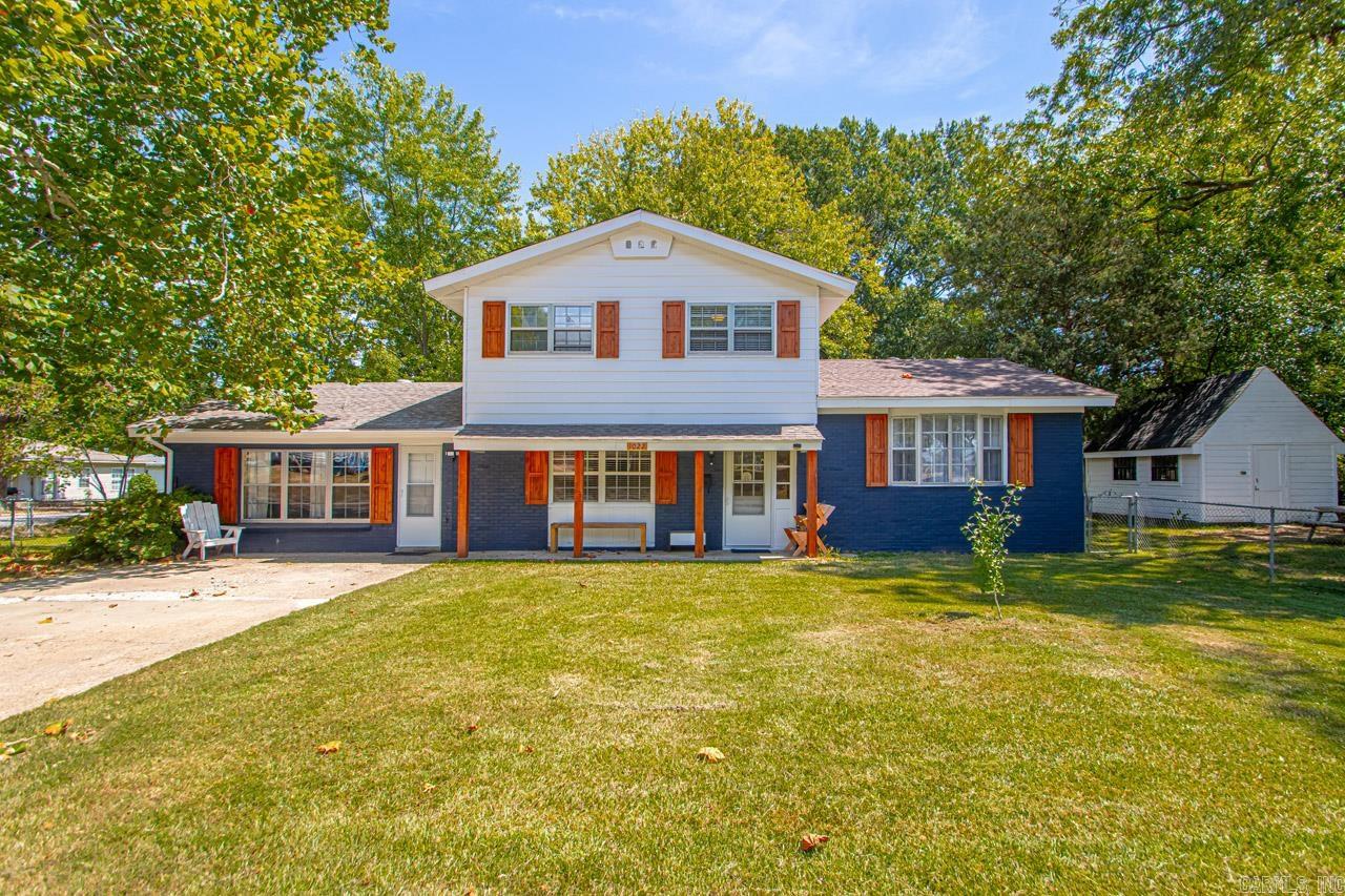 This home sits on a large corner lot and is within walking distance of Ida Burns elementary, Conway Junior High, and Conway, Laurel & Veteran’s park, & the Tennis Center. 5 minutes from UCA and Conway Regional. Large back yard is entirely fenced with double gates on two sides. 12 x 16 shop with a loft and roof that is 5 yrs old. Roof on house is 5 yrs old. 12 x 16 deck on back of the house. New outdoor paint and 3 storm doors. Two living areas, one with new LVP flooring, could also include a formal dining area. Second is a large den with lots of possibilities. Kitchen is large enough for a breakfast nook and counters recently resurfaced. Garbage disposal and cooktop less than a year old. Dishwasher is less than 5 years old. Ground floor also includes a half-bath and utility, which could double as a pantry or home office. The large converted garage ($1,000 flooring allowance) could be a playroom, office, home gym, music room, or third living area. New 5-ton HVAC unit, water heater and LED lighting downstairs and in the upstairs bathrooms. New carpet on stairs and upper landing. Upper level with 3 bedrooms, hardwood floors, 2 baths. New vanity in guest bath & ceiling fan in all rooms