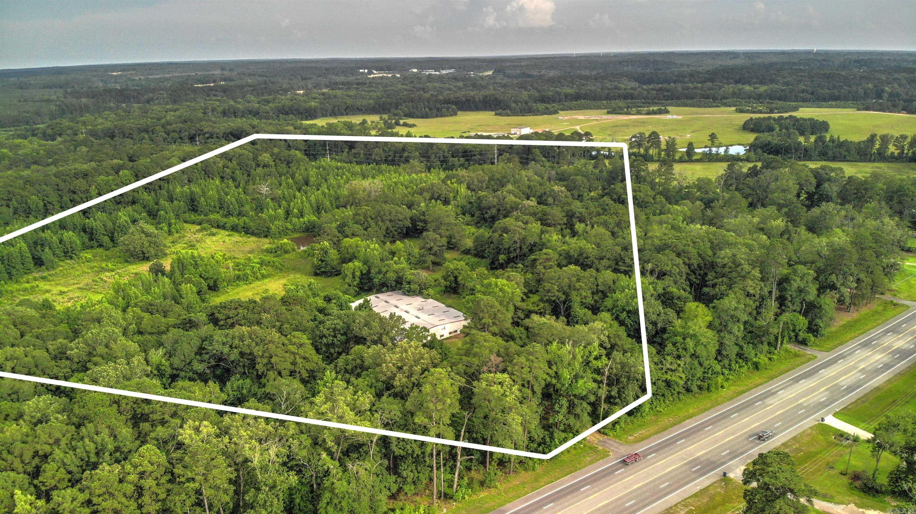New Listing | 60 Acres | Calion Highway Welcome to a rare and versatile opportunity on 60 acres of beautiful countryside along Calion Highway. Formerly EO Ballard Patchwork Farms, this property carries a rich history and endless potential. A massive 150x120 barn—previously used to board horses—stands as the centerpiece, offering a solid foundation for your dream equestrian facility, wedding venue, or future event space. The land also features a peaceful pond and cross fencing, making it ideal for livestock or multiple pasture setups. Whether you're envisioning a charming countryside home, a working farm, or a unique destination venue, this property offers the space and setting to bring your vision to life. Don't miss the chance to own a piece of local history with limitless possibilities!