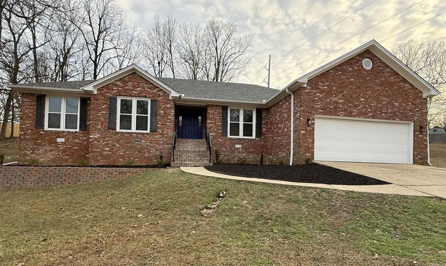 Freshly updated 5-bedroom, 3-bath brick residence offering 2,398 sq ft on a spacious lot in a sought-after neighborhood. Thoughtfully designed with granite countertops and custom white cabinetry throughout, stainless steel appliances, pantry, and waterproof laminate flooring in the main living areas. The inviting living room is anchored by a wood-burning fireplace. A flexible layout includes a private bedroom with en-suite bath, ideal for a guest suite or multi-generational living. The custom primary suite features a tile shower, freestanding soaking tub, and an oversized walk-in closet. Major updates include roof and windows replaced approximately 2 years ago and a new water heater, offering peace of mind alongside refined finishes and versatile living spaces.