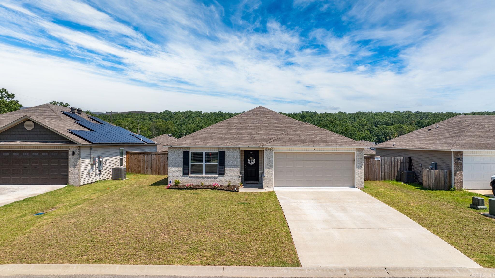 DON'T MISS THIS CUTIE! Be sure to watch the video walkthrough! https://listings.keyimageworks.com/sites/lkqrqxm/unbranded This well-maintained 3/2 is full of curb appeal with its welcoming covered front porch and front yard landscaping. This home features an open and split floor plan and an expansive family room with a raised 9' ceiling. Enjoy a gorgeous kitchen fully equipped with energy-efficient appliances, 16" bar top for extra seating, ample counter space, and a roomy pantry. You'll find LVP flooring in all wet areas and clean carpet in the bedrooms. This home has its own laundry room off the kitchen and leads into the two-car garage. When you enter the backyard, you'll notice the covered back patio and a fully fenced-in yard. This house is less than 10 minutes from Conway and I-40 and 15 minutes from Greenbrier. Property Disclosure on file! Schedule a showing on BrokerBay today! :)