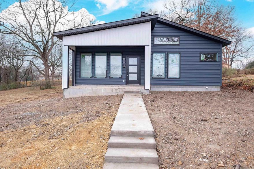 Looking for AFFORDABLE New Construction??  Here it is so hurry to see it.  Modern style and effortless flow.  This thoughtfully designed 3 bedroom, 2 bath home features an inviting open concept living and dining area create a bright connected space ideal for everyday living and entertaining.  Modern finishes deliver a fresh upscale look.  Parking at the rear.  Close to public transportation, interstate and more.  Builder/designer is a young architect with a heart for creating affordable housing.  Grass and landscaping going down in a couple of weeks.  Don't miss this opportunity!!Hurry to see it! INVESTORS check it out too!