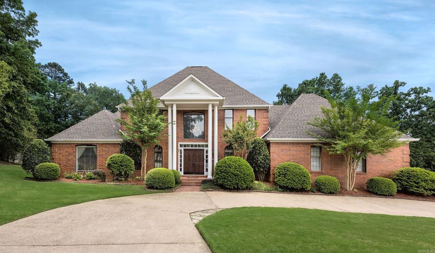 Luxury living meets timeless elegance in this exceptional Pleasant Valley Estates home located in one of West Little Rock’s premier gated communities. Situated on a beautifully landscaped 0.74-acre lot, this expansive 5-bedroom, 4.5-bath residence offers approximately 5,900 square feet designed for both entertaining and everyday comfort. The spacious floor plan features soaring ceilings, abundant natural light, a grand entry, formal dining room, office/study, game room, bonus room, and a dedicated media/theater room. The main-level primary suite provides a private retreat with a sitting area and spa-like bath. The gourmet kitchen is equipped with double ovens, gas range, large island, breakfast bar, pantry, and generous cabinetry, opening seamlessly to inviting living spaces with fireplaces and custom details throughout. Additional highlights include hardwood and tile flooring, wet bar, central vacuum, safe room, walk-in closets, and extensive storage. Enjoy the covered patio and private backyard setting perfect for relaxing or entertaining guests. Experience luxury, space, and privacy in an unbeatable location—schedule your private showing today!