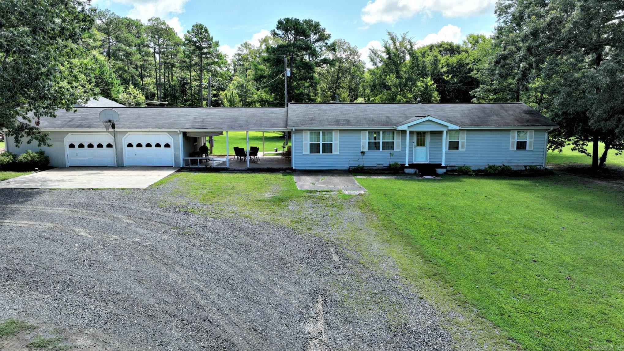 Discover the perfect blend of comfort, style, and functionality in this spacious country home, beautifully remodeled with modern touches throughout. Enjoy cooking in the updated kitchen featuring gorgeous granite countertops and bamboo flooring that flows seamlessly through the living spaces. The oversized primary bedroom offers a peaceful retreat with a luxurious ensuite bath complete with a large jetted tub and tiled shower. Step outside to a large garage connected by a breezeway that doubles as a shaded patio areaāideal for relaxing or entertaining. A well-equipped shop with 220 power and a 30-amp RV hookup with water makes it easy to work or travel with convenience. Additional features include a pole shed for equipment storage, a charming chicken coop, and a newer HVAC unit just 2.5 years old at the time of listing. This property offers all the space and extras you need to live the country life in comfort!