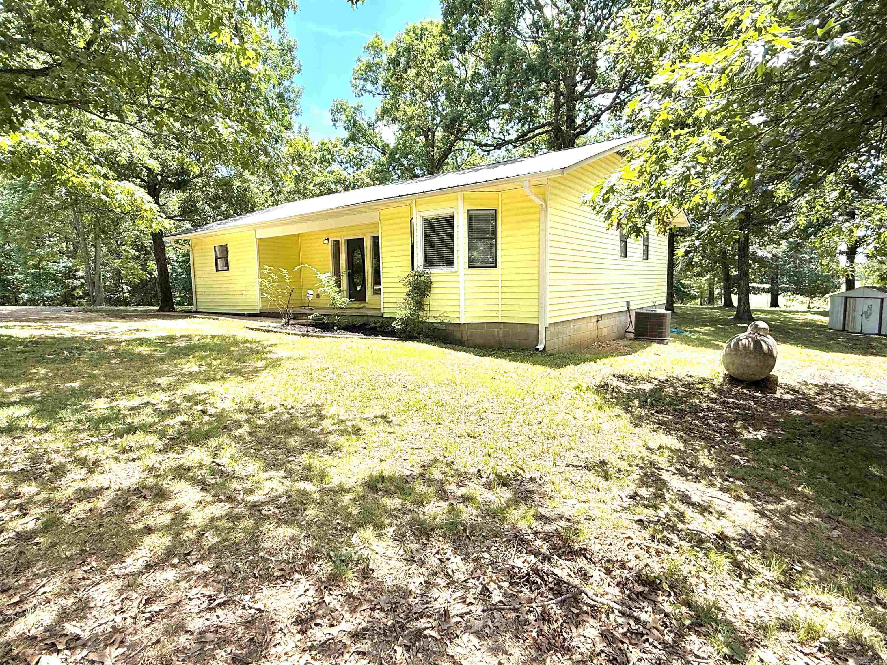 Don’t miss your chance to own this beautiful 2-bedroom, 2-bathroom home on 2.94 peaceful acres in Sidney, Arkansas. Nestled in the rolling hills of the Ozarks, this property offers the perfect blend of modern updates and serene country living. Step inside to an inviting open floor plan featuring a beautiful modern kitchen. The spacious master suite includes a private full bathroom, offering both convenience and privacy. Outside, enjoy relaxing afternoons under the natural shade of mature trees on your new back deck or screened in back porch. In addition, this property features a storage building for all your tools and outdoor gear. This move-in-ready home is truly a rare find in the Ozarks and is priced to sell for only $169,900! DON’T MISS OUT—schedule your showing today!