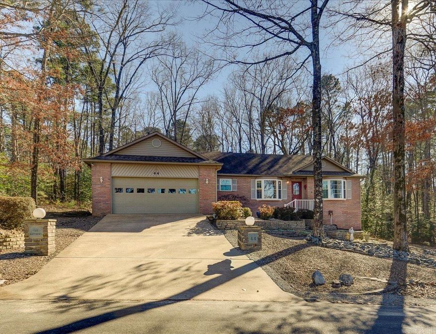 Meticulously maintained, this well-cared-for home offers peaceful views of Lake Balboa just across the street. The inviting living room features a vaulted ceiling and gas log fireplace, creating a bright, open space ideal for relaxing or entertaining. The kitchen provides abundant cabinetry, efficient layout, and a comfortable dining area with lake views. A split bedroom floor plan ensures privacy, highlighted by a spacious primary suite with ensuite bath and generous walk-in closet. Enjoy outdoor living on the back deck and lower patio—perfect for morning coffee, grilling, or unwinding in a quiet natural setting. Appliances convey, making this home truly move-in ready. Lovingly maintained inside and out by the same owners since new, this property offers comfort and convenience just minutes from lake access, golf, trails, and all the amenities of Hot Springs Village. Please refer to the virtual tour for the best overall presentation and photos.