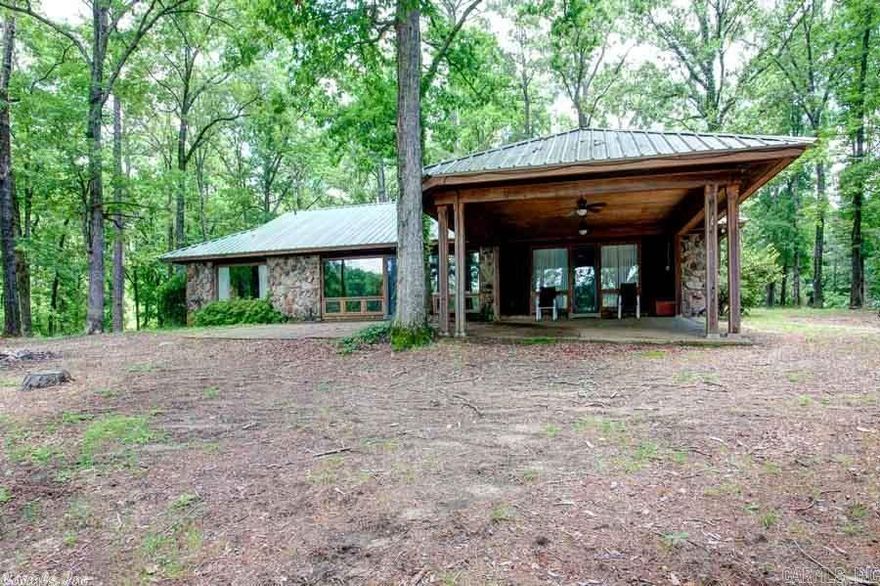 Newly remodeled Rustic 1-Level home overlooking beautiful private lake! 20X20 tile floors throughout the home, 3 Lge Brms (Master overlooks the lake) 2 1/2 Bas, Lge laundry/storage area, Lge Vaulted Great/Rm with Massive Rock F.P., Oversized Double Carport, Fully furnished 600 Sq. Ft. guest house, Covered picnic area with private dock! This is a one of a kind property! House and 27 acres can be purchased separately for $397,000!