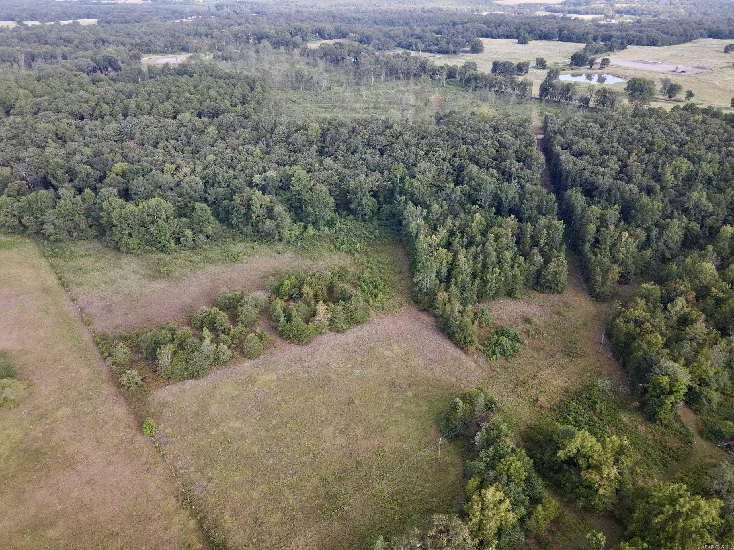 This beautiful rural property offers the perfect combination of privacy, natural beauty, and convenience. With approximately one-quarter mile of county road frontage, access is easy, and utilities are already in place - including rural water, electricity, and high-speed internet - making it ready for your dream home, recreational getaway, or long-term investment. Adding to the property’s charm is a large seasonal creek that flows across the land.