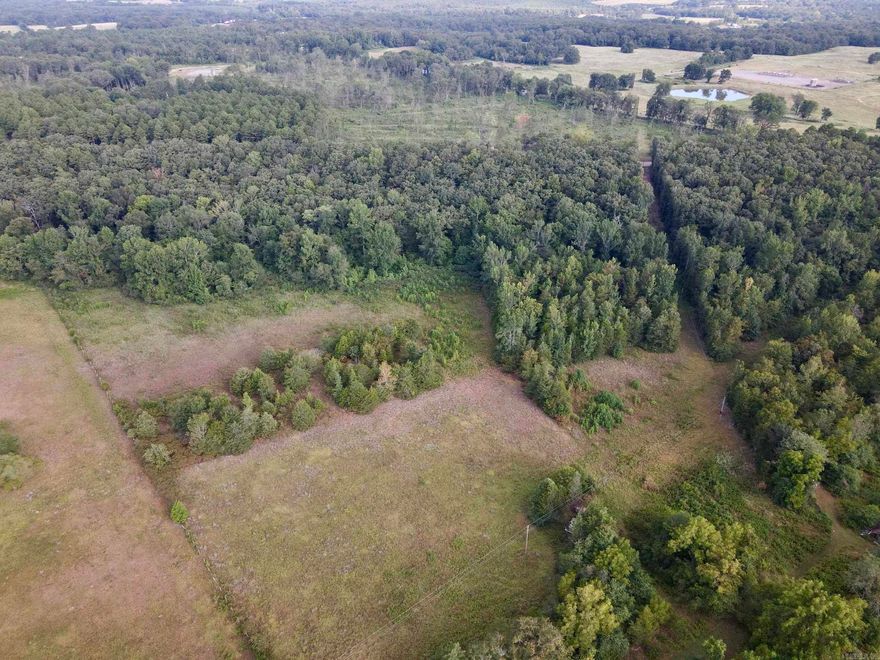 This beautiful rural property offers the perfect combination of privacy, natural beauty, and convenience. With approximately one-quarter mile of county road frontage, access is easy, and utilities are already in place - including rural water, electricity, and high-speed internet - making it ready for your dream home, recreational getaway, or long-term investment. Adding to the property’s charm is a large seasonal creek that flows across the land.