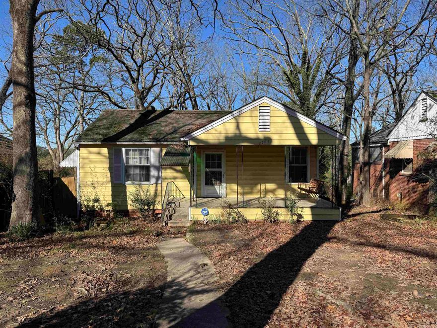 Cute yellow cottage almost in the UALR campus. Perfect for investors, students or starter home. Hardwood floors throughout. Covered front porch and back porch. Back alley parking. Large work space with concrete slab in crawl space. To be sold as-is. Agents see remarks. Recent pre-inspection available upon request.