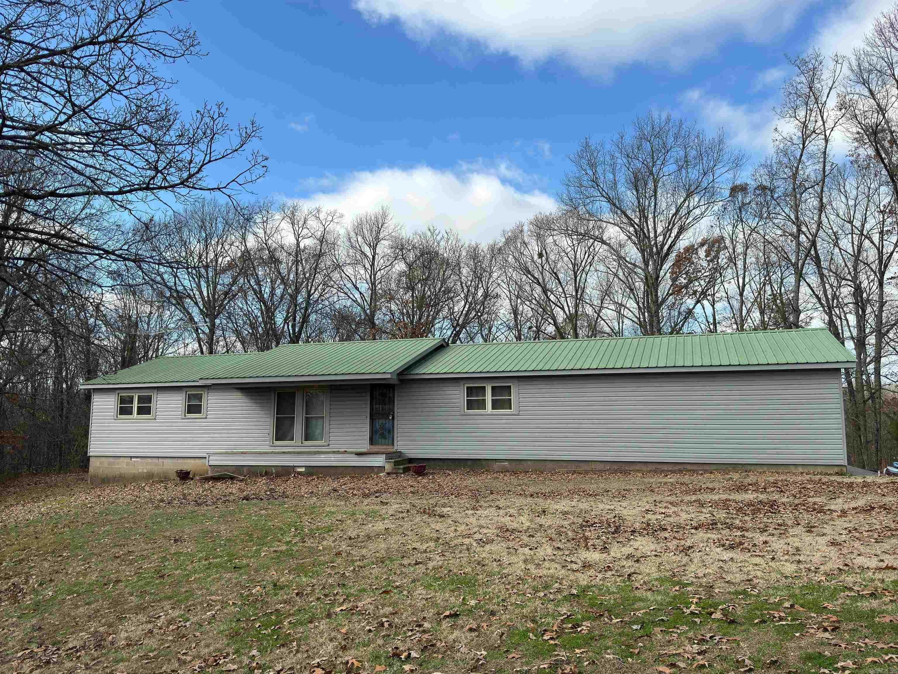 Two bedrooms, two bath country home setting on approximately 3.1 acers according to courthouse records. With a little vision and updating this could be a wonderful home. This property also comes with a large shop.