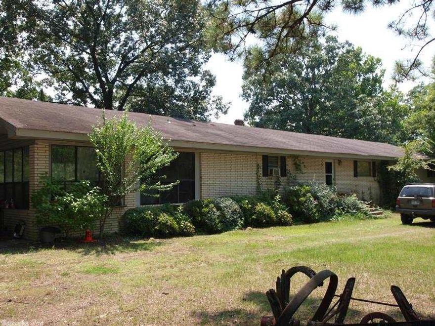 Property being sold AS-IS only! 10 acre lot that is prime for development directly across Springdale from the Remington Subdivision. Deep lot that borders the back side of Springhill Elementary School. There is a second building site available behind the existing home site! The existing home site will need a total remodel, if it is not demolished or moved. Detached 30 x 40 concrete block garage or workshop!