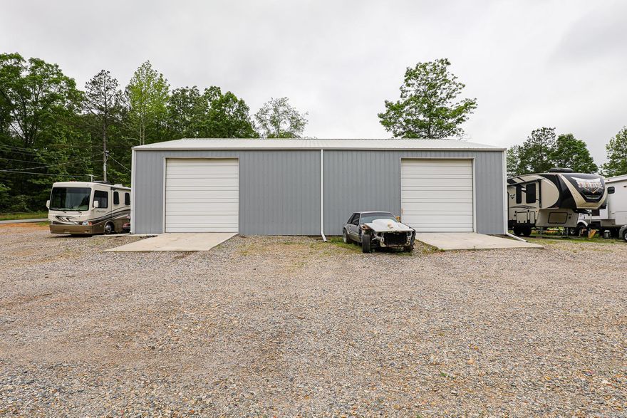 NICE TRACT WITH A 2 BAY SHOP BEING USED RIGHT NOW AS A FIBERGLASS BUSINESS. SEVERAL OFFICES HAVE BEEN WALLED UP BUT NOT FINISHED. SEPTIC IS IN AND BEING USED ON A COUPLE OF RV'S. THIS WOULD MAKE A GREAT AREA FOR STORAGE BUILDINGS OR FOR AUTOMOBILE USE OF ANY KIND. WITH AN ACCEPTABLE OFFER SELLER WOULD BE WILLING TO GET THE BACK PART OF THE PROPERTY FILLED IN WITH DIRT.