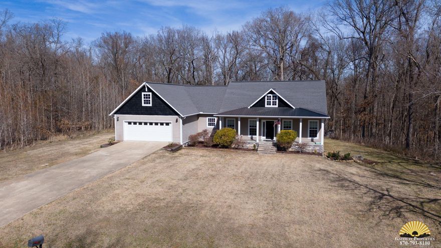 NESTLED AMONG 1.60 wooded ACRES this CUSTOM-BUILT home has all the I WANTS! 4-bedrooms, 2.50 baths with an OFFICE and almost 2800 square feet this home offers room for EVERYONE. The inviting living room is highlighted by a vaulted ceiling, stone gas fireplace, beautiful flooring, and a WALL OF WINDOWS. With an open floor plan, the efficiently designed kitchen with recently updated appliances and custom cabinets will look good against your groceries. PRIMARY BEDROOM and bathroom are situated for privacy, with double vanities, a tile walk in shower and SPACIOUS walk-in closet. 2 additional bedrooms on the main level with the 4th located upstairs. You will be AMAZED at the additional storage space the attic and crawl space provide. Slab poured in the crawl space offers EXTRA ROOM for all those seasonal decorations or lawn equipment. REST ASSURED you will ENJOY sitting on your large deck in the quiet seclusion of your tree lined yard. Country living with City convenience, you won't WANT TO MISS seeing THIS ONE!