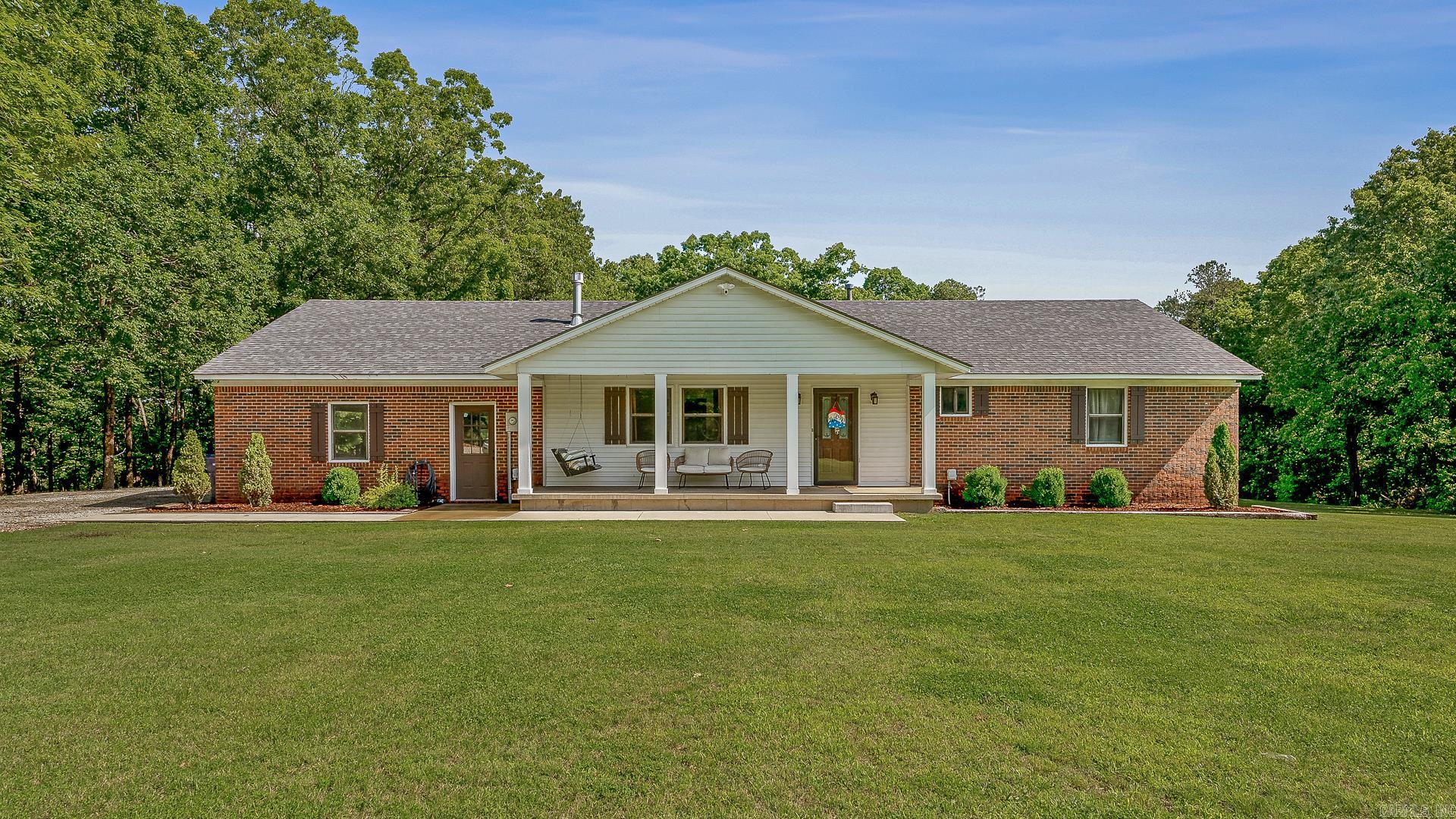 This beautifully updated home offers space with over 3,000 sq. ft. and 3 acres, flexibility, and peace of mind with a NEW HVAC (2025) and new septic system with field lines (2023). Featuring 4 bedrooms and 3 full bathrooms, the home also has the potential for a 5th or even 6th bedroom. The main level includes 3 bedrooms and 2 full bathrooms, highlighted by a fully remodeled guest bath (2024) with new tub, tile surround, and vanity. The kitchen showcases quartz countertops, a subway tile backsplash, and updated lighting, with neutral paint and wood flooring flowing throughout. The walk-out basement, finished in 2024, offers a second living room, playroom, office, storage, 1 bedroom with walk-in closet, and 1 full bathroomplus additional space to expand for more bedrooms if needed. Sitting on 3 peaceful acres just north of Jonesboro in the Greene County Tech School District, this property perfectly blends modern updates with country living. Schedule your showing today!
