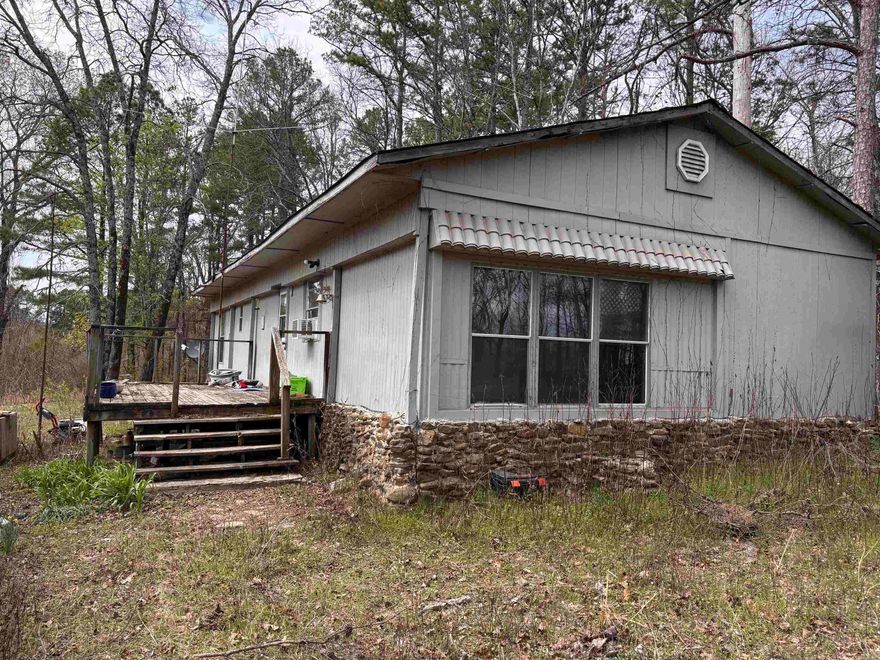 Great investment property! Single wide mobile home with add-ons sits on one acre in the country. 3 bedrooms & 1 full bath.  Selling AS-IS.  Seller will not make any repairs and seller will not turn on any utilities.