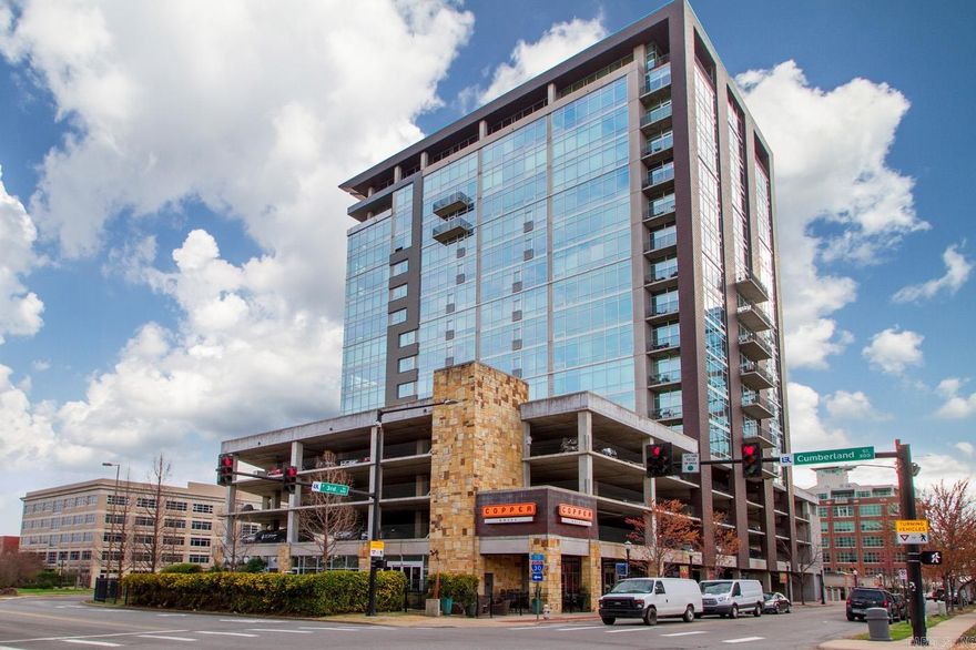 Experience the best in urban luxury in this stunning downtown high-rise condominium. Located in Little Rock's vibrant River Market District, this premier corner unit features one of the most favorite floorplans in the building, with two ensuite bedrooms, spacious living area, dining space surrounded by walls of windows, and private balcony. Inviting neutral color pallet and sleek high-end finishes. Large primary bedroom has generous walk-in closet with built in storage and spa-like bath with double vanities, extra linen storage, walk-in shower, and separate soaking tub. Enjoy the convenience of remote-controlled blinds in living and dining areas. New hardwood floors throughout entry, living, kitchen, and dining areas installed in 2024. Purchase includes two reserved parking spaces. Amenities of 300 Third Tower include pool, fitness center, rooftop entertaining room, patio, dog walk, and full-time concierge service. Monthly resident social events. Enjoy dining downstairs at Copper Grill, stroll to the River Market for live music, or nearby River Trails for a walk or bike ride. Note: Condo could be sold fully furnished. *Agents see remark*