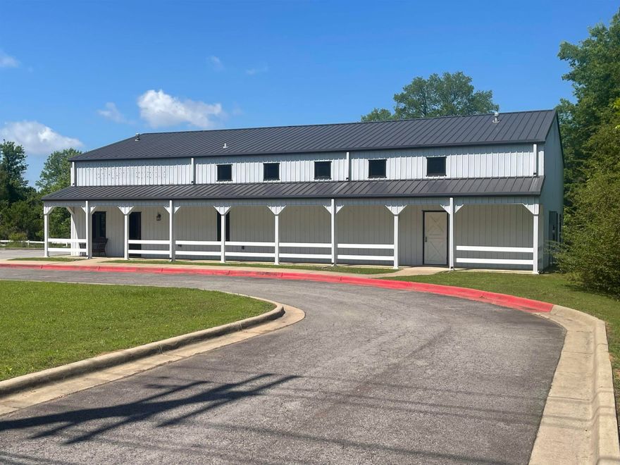 Multi-purpose building in a prime location. Only minutes to I-40 and shopping. It was most recently Ozark Mtn Trading Co, it would make a great event center, church, school or retail space. It has an unfinished loft area. It has a kitchen, 1 full bath and 2 1/2 baths. It's situated on 1.6 acres with a paved parking lot. Mixed-use floors.