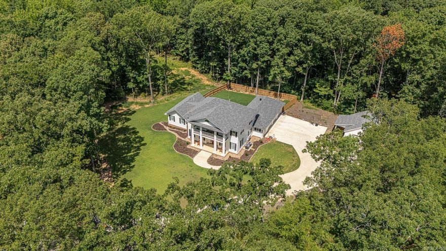Nestled in the middle of a 6.6 acre wooded lot, this custom-built masterpiece provides the seclusion of a country setting while also offering all the amenities and access of living in the city.  The construction, which was completed early in 2023, is a perfect blend of old, southern charm combined with the modern conveniences we all desire.  At 3,270 square feet, this four bedroom, three and a half bathroom home in the Valley View School District is a must-see.