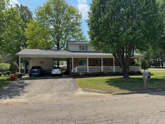 VERY NICE 4BR/2BA HOME! 1900+ square feet in this very well maintained home! Home has 4 bedrooms and 2 bathrooms including 2 suites. Master suite with bathroom, 3 sinks and his and her closets on main floor, 2nd suite, 2 additional bedrooms and 1 bathroom upstairs. Large living room with dining area and nice kitchen with breakfast nook, granite countertops, under cabinet lighting, lots of custom cabinets, stove, refrigerator, microwave, dishwasher and garbage disposal. Small laundry room with washer and dryer included. Home is all electric with monthly electric bill averaging just $134! Some home features include 3 year old roof, 8 year old central heat and air, landing office area, lots of storage, walk in closet, closet lighting and gorgeous covered country front porch! Owners love the great neighbors and how quiet they find the street to be. Home is rock and siding and has a 2 car carport with storage room. Close to schools and hospital/Dr offices. Call for a tour!