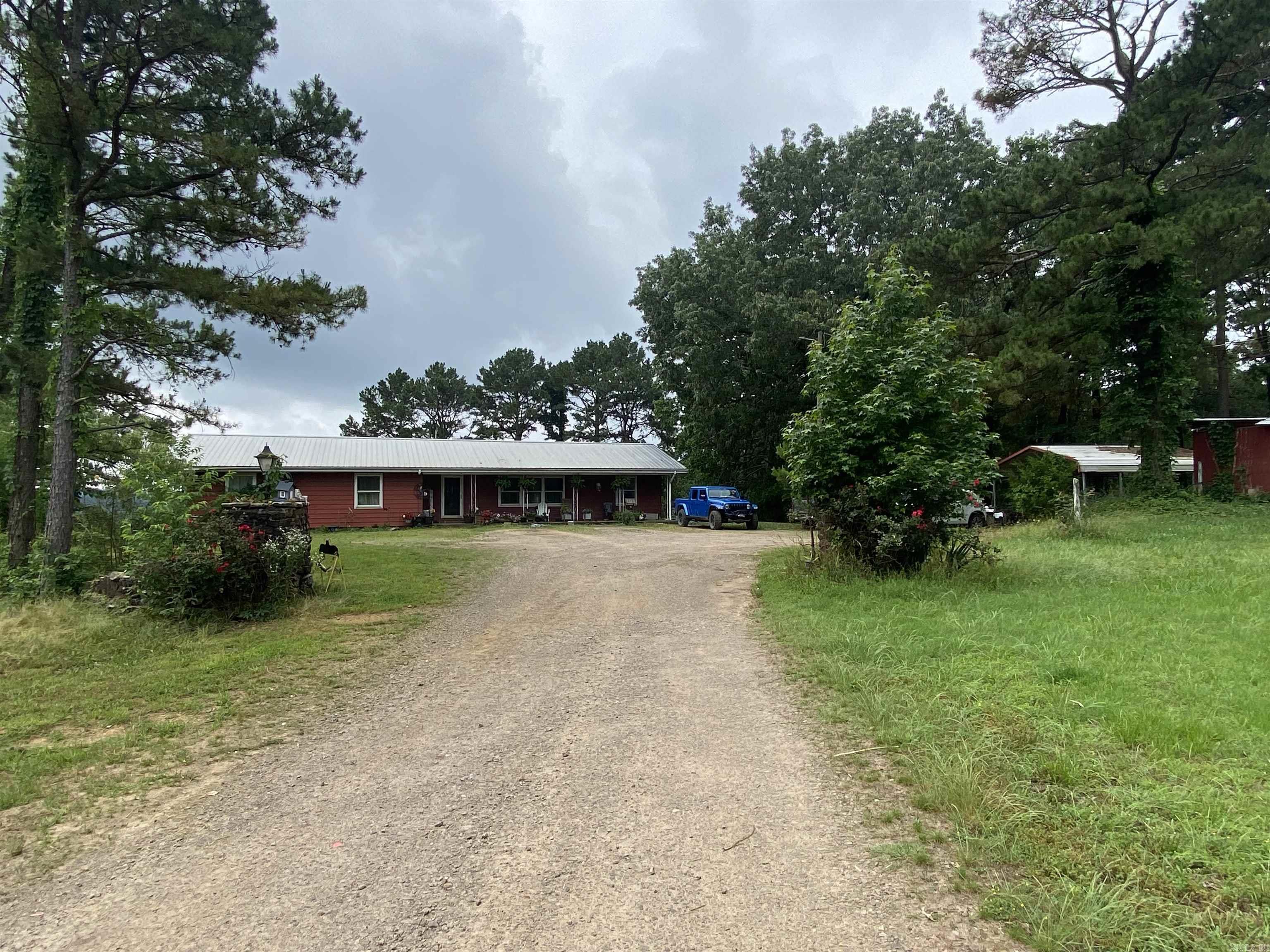 Farmer's dream!! Cattle farmland ready for you with 80 acres of woods and pasture land all cross-fenced with two ponds, fenced in garden with fruit trees, iron corral with holding shoots and 5 holding ens with one storage shed!! Over 4800 square foot home with 7 beds 3 bath featuring family room, storage room and additional storage under the stairwell! This is a must see!! Call today!