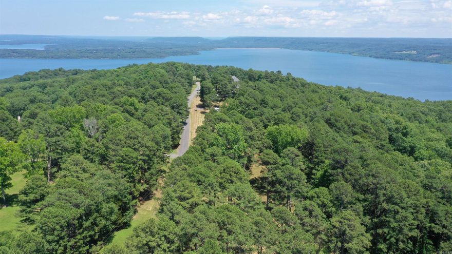 Discover the perfect canvas for your dream home on this 5.65-acre lot overlooking the beauty of Greers Ferry Lake and the surrounding mountains. This property offers a blend of privacy, spectacular views, and easy access to everything you need. Whether you're planning to build a full time residence or a weekend getaway, this lot is ready for you to bring your vision to life. Electricity is already on the property, and water is available at the road. There’s plenty of room to spread out, and the views truly speak for themselves. If you’ve been waiting for the right piece of land, this one is worth a look!  See Drone Video!