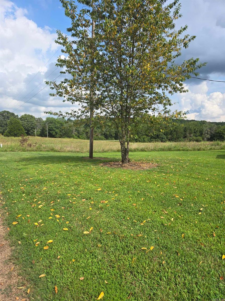 Nestled in the country but close to amenities! This land is beautiful! Almost 10 acres! Also has access to a creek! Has a previous dairy barn behind the house. House and barn need work but have good bones! House is as-is. Electric and water on property.  Well on property! Needs septic.  Home is over 100 years old, lots of old charm!  Schedule a tour of this land today! No restrictions on land.