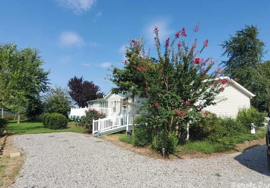 Welcome to Market this very well maintained manufactured home that sits on 4.76 acres m/l, extra landscaping, New flooring, new paint, large outside storage/shed, roof was replaced in 2015,storm cellar, well house (Well has four exterior faucets) Home is on city water, gazebo to enjoy the sunsets. The home has large kitchen with islander, formal dining room, 3 bed/2bath, large living room to enjoy your time with the family. Come check out today!