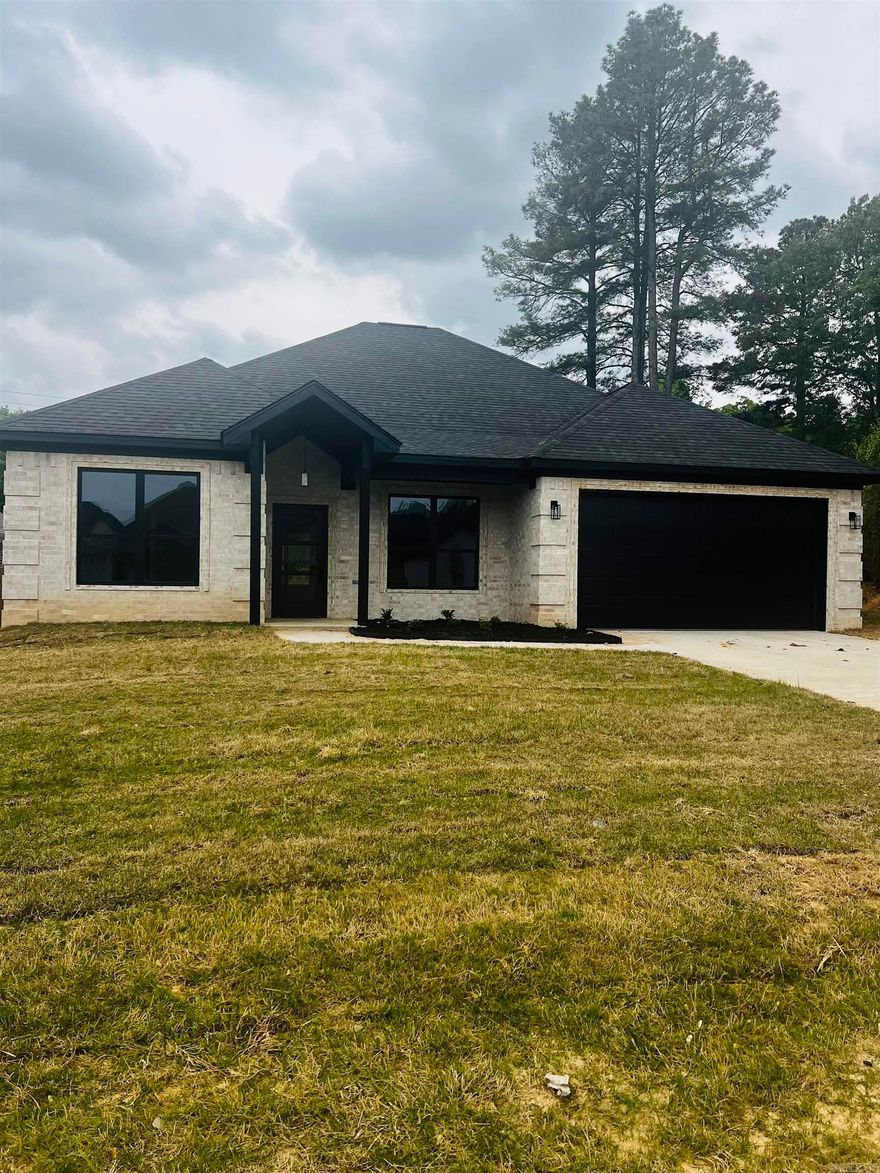 .Situated in a neighborhood in high demand, this stunning 3 bedroom, 2 bath home offers the perfect blend of style and serenity. The primary bedroom is positioned to provide a sense of separation from the guest bedrooms, ensuring a peaceful retreat. The kitchen is equipped with GE appliances, featuring sophisticated stainless steel packages, while the laundry room showcases impressive Matte Porcelain Floor Tile. Additional highlights include a spacious walk-in pantry, Quartz countertop work island/breakfast bar, and expansive living area that flows into the kitchen. The Open Family Room is complete with an electric fireplace and accent walls.  Perfect way  for unwinding enjoying the wood-burning fireplace on the covered back patio. This home will be finished April 3 2025