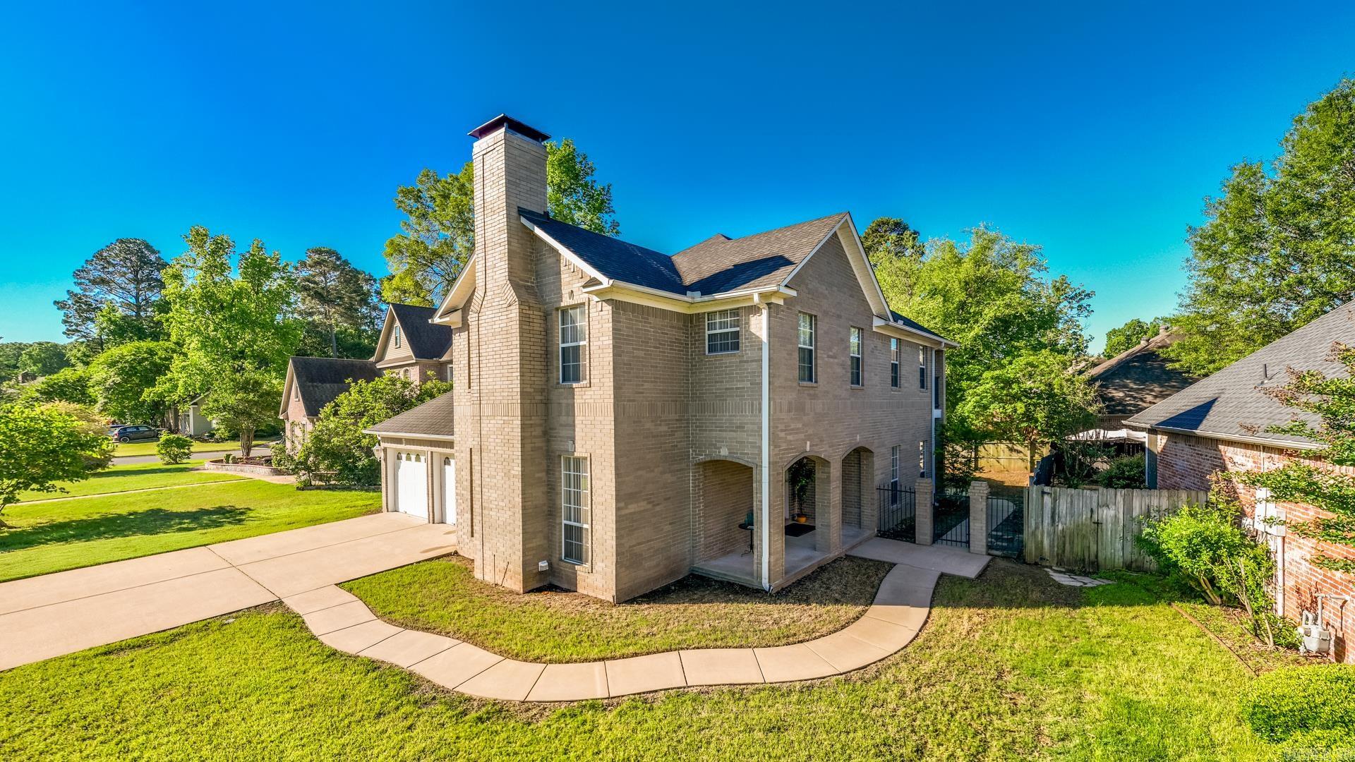 Stately all-brick home in the desirable Country Club of Arkansas! This well-maintained property features a side-entry and opens to an oversized living area filled with natural light and a cozy fireplace—perfect for everyday living and entertaining. Plush carpet runs throughout most of the home, with tile in the kitchen and baths and a beautiful, authentic marble entry. The spacious formal dining room is currently used as a second living area, offering flexibility to suit your needs. The large kitchen includes granite countertops and backsplash, ample cabinetry, and a cozy dining nook. The main-level primary suite features a huge walk-in closet and a spacious bath with a jetted tub and separate shower. Upstairs you’ll find three generously sized bedrooms—one currently used as a home gym. A full hall bath serves two of the bedrooms, while the third has its own private ensuite. The fully fenced backyard offers privacy, a covered patio for relaxing, and backyard is being re seeded. All LED lighting and extra insulation help make it more energy efficient. Wonderful opportunity in a sought-after golf course community!
