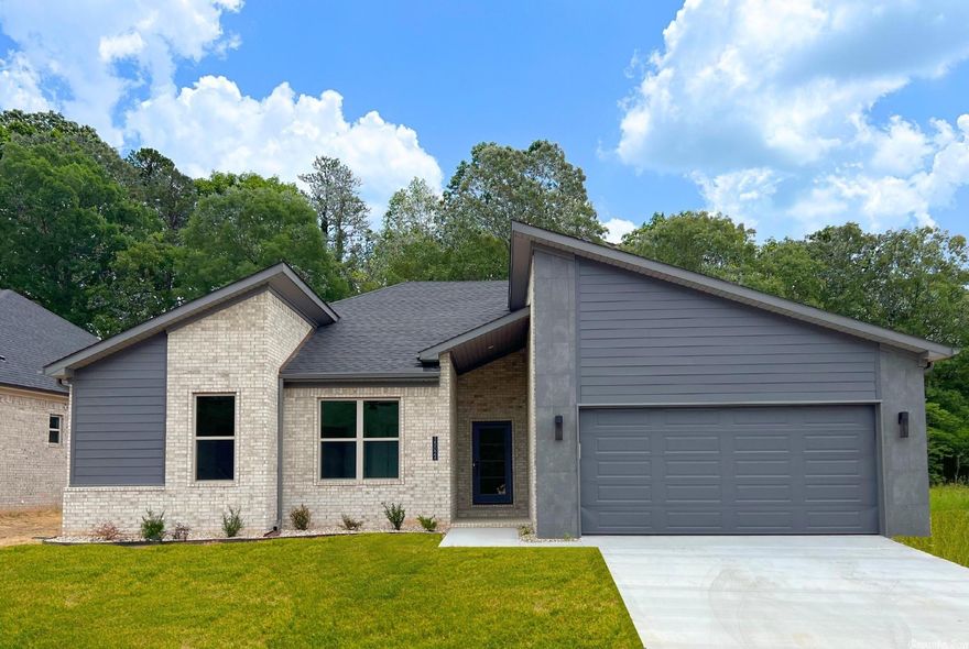 Move in Ready! This stunning, modern residence offers a perfect blend of elegance, functionality, and natural beauty. This 4-bedroom, 2-bathroom home spans an impressive 2,100 square feet and boasts an open floor plan that seamlessly integrates the living spaces. As you enter the home, you'll immediately be captivated by the contemporary design elements and meticulous attention to detail. The spacious living area features high ceilings, abundant natural light, and sleek, minimalist finishes, creating an inviting and airy atmosphere. The open floor plan allows for effortless flow between the living room, dining area, and kitchen, making it ideal for entertaining guests or enjoying quality time with family. One of the most enviable features of this home is the protected green space located behind the property. Imagine waking up each morning to the serene view of lush foliage and a picturesque landscape. The large patio provides the perfect setting for outdoor gatherings, barbecues, or simply enjoying a morning cup of coffee while basking in the tranquility of nature. Fully fenced yard. Conveniently located close to the I-40, Morgan/Maumelle Exit.