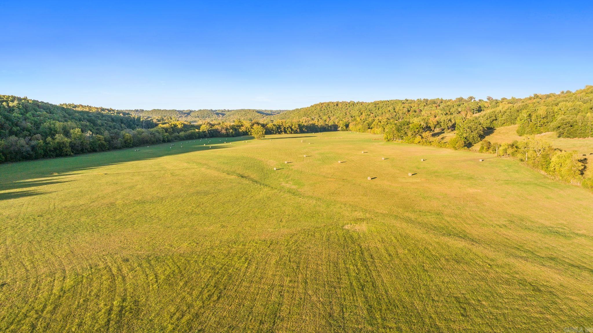 Escape to your own slice of paradise in Marshall, AR! This stunning 58-acre property is a nature lover's dream! Nestled in the heart of the Ozarks and teeming with wildlife of elk, deer, turkey. This pastureland is perfectly positioned with the majestic Ozark Mountains as your backdrop and Bear Creek flowing gently along the border of the property. This property offers an expansive hay field for farming or cattle grazing, endless outdoor adventures, and the serene sounds of nature right at your doorstep. Whether you’re looking to build your dream home, start a hobby farm, or simply enjoy the beauty of the Ozarks, this property has it all. Don’t miss this huge opportunity to own one of the best parcels in all of Searcy County!