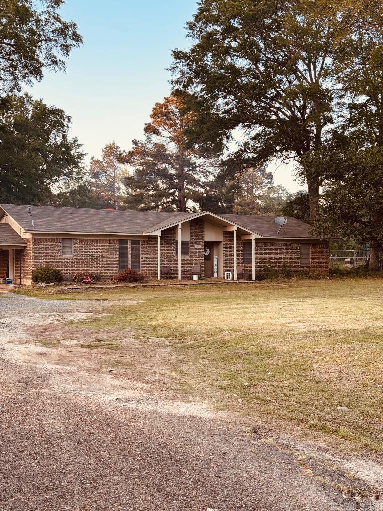 This charming single family home is perfect starter home. Featuring 3 bedrooms and 2 bathrooms with an office/ workspace. The spacious yard offers just what you need for gatherings or to just plant a garden. Small storage shed on the property. This place is on Arkansas side outside of the city limits. In just 10 minutes you can be anywhere in town. This home sits just under 1 acre at .83 Acres just outside the city limits.