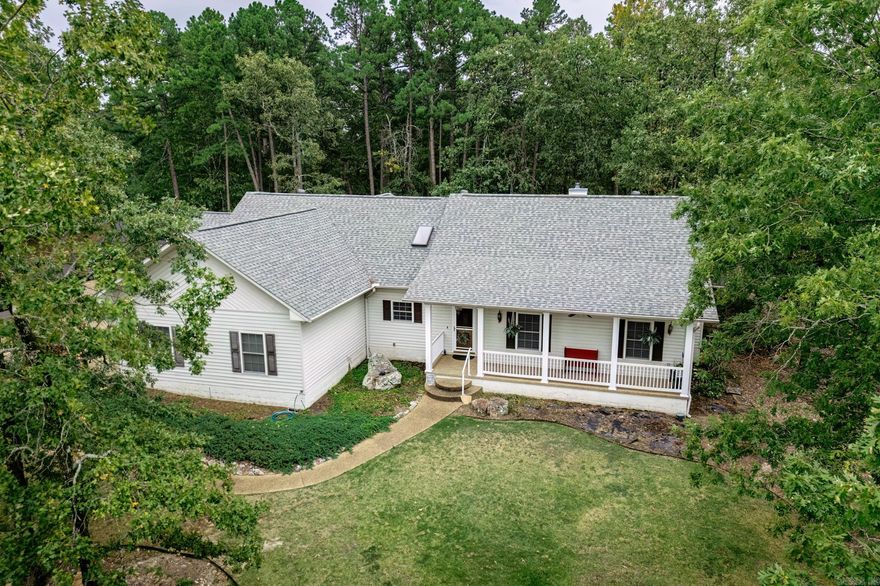 Built in 2004, this 2314 square foot single level Southern farm style home has been updated with hickory wood floors. New granite kitchen counters. No carpet except in primary bedroom closet. Master closet is huge. Master bath has tub and walk-in shower. Guest bath has walk-in shower.  New roof and heat pump in 2020. Heated and cooled sunroom. Recirculating hot water system. Three bedrooms, two bath and a dedicated office with built-in's. Laundry room.  Fenced and flat backyard with covered outdoor cooking area. and concrete patio. Covered front porch. Four car garage, three for cars and one is set up for a shop.