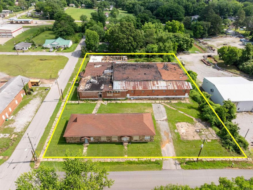 Welcome to a truly one-of-a-kind property in the heart of Newark, Arkansas - the historic Newark Old School. Filled with character, memories, and endless possibilities, this unique property offers a rare opportunity to own a piece of local history while creating something entirely your own. For generations, this school served as a gathering place for the community, and many will remember the countless games, events, and memories made inside the old gymnasium. Today, the property remains full of potential with large open spaces, the original gym, and a 3500 +/- square foot shop building that includes a built-in apartment, making it ideal for residential, commercial, storage, event space, or investment opportunities.