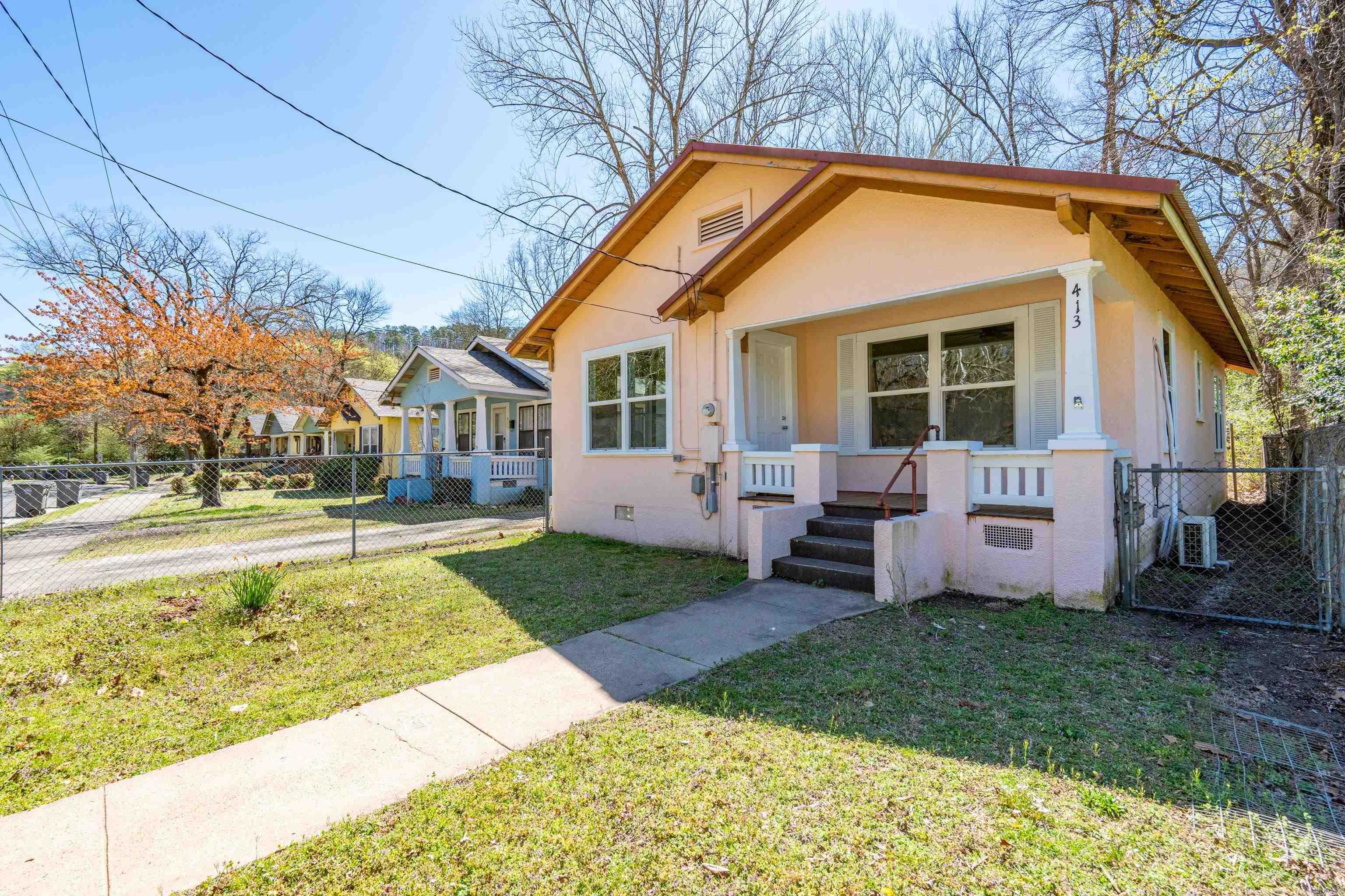 Charming Vintage Bungalow Near Whittington Park & Hot Springs National Park! Nestled in a prime location just steps from scenic Whittington Park and moments from the renowned Hot Springs National Park trails, this beautifully updated 1940 bungalow blends historic charm with modern convenience. Set on a flat lot, this cozy 2-bedroom, 1-bath home boasts restored wood floors in most areas, complemented by new vinyl flooring in the kitchen and bath. Recent updates include new windows, doors, light fixtures, and electrical outlets, ensuring both comfort and efficiency. The kitchen is equipped with a new oven/stove, microwave, and refrigerator, while a new water heater adds peace of mind. Relax on the covered front porch, enjoy the privacy of the fenced yard, and take advantage of two new mini-split HVAC units for year-round comfort. A metal roof offers long-lasting durability, and the washer and dryer are included for added convenience. With easy access to the Parkās natural thermal water springs, this home is a rare find in a desirable location. Donāt miss the chance to make it yoursāschedule a showing today!