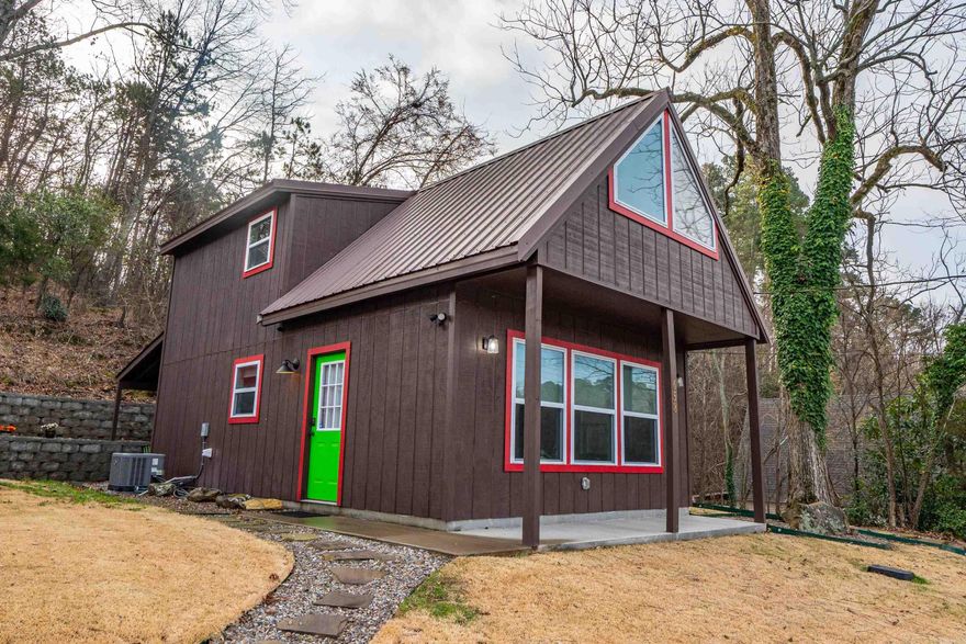 Adorable 2022-built cottage offering the perfect blend of charm, quality construction, and investment potential! Located just 0.7 miles from the Arlington Hotel, this thoughtfully designed property sits in an Opportunity Zone and allows for short-term rentals, with flexibility for residential or commercial zoning. Inside, the bright and open floor plan lives large with a spacious feel, highlighted by shiplap walls, a statement chandelier, and a beautifully finished full kitchen featuring quality materials and craftsmanship throughout. Every detail reflects a well-built home with character and style. Step outside to enjoy the cabin-inspired exterior, original rock retaining walls, and scenic mountain views that create a true Hot Springs retreat atmosphere. *acreage unknown...to be decided by new surve Ideally positioned within walking distance to Uptown and Downtown dining, shopping, coffee bars, and nearby mountain trails & biking trails, this property offers both convenience and lifestyle appeal for guests or full-time use. A rare opportunity for a turnkey short-term rental, weekend getaway, or unique commercial venture in one of Hot Springs’ most desirable and walkable locations!